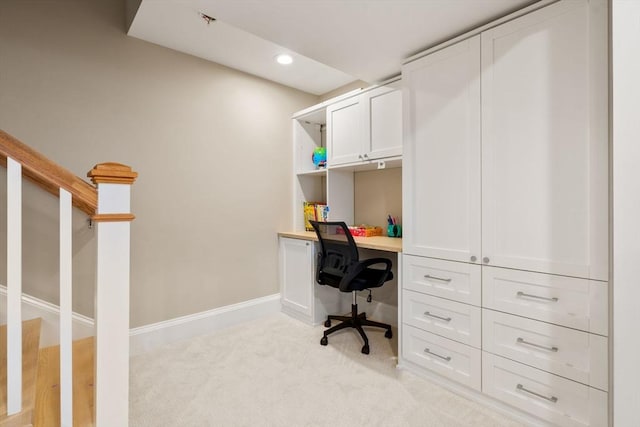 office with recessed lighting, light colored carpet, built in study area, and baseboards