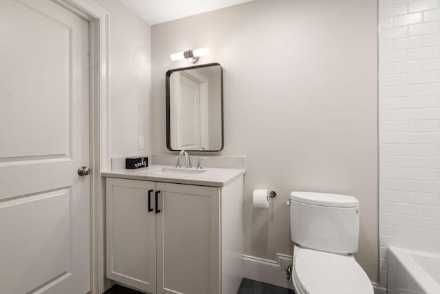 bathroom featuring toilet and vanity