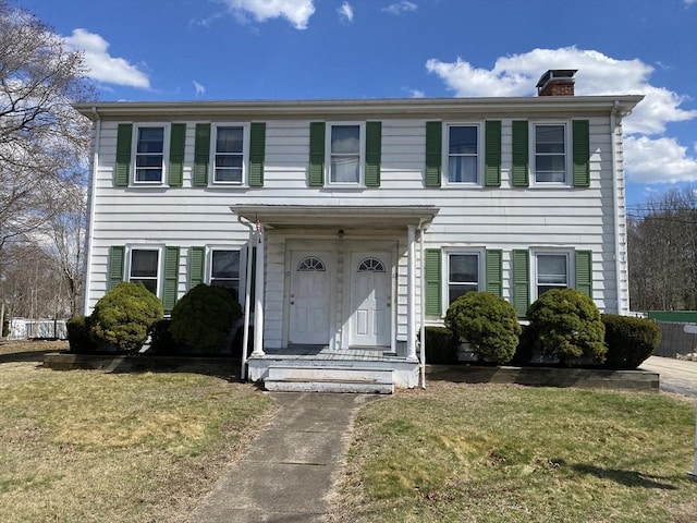 10-12 Spring St, Rockland, MA 02370 - colonial inspired home featuring a chimney and a front yard