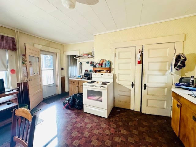 kitchen featuring crown molding and white range with electric stovetop