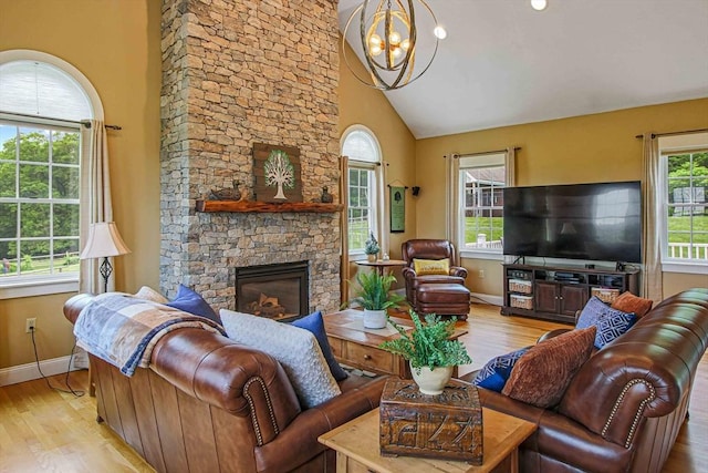 27 Southwick Rd, Sutton, MA 01590 - living area featuring wood finished floors, a chandelier, baseboards, a fireplace, and high vaulted ceiling