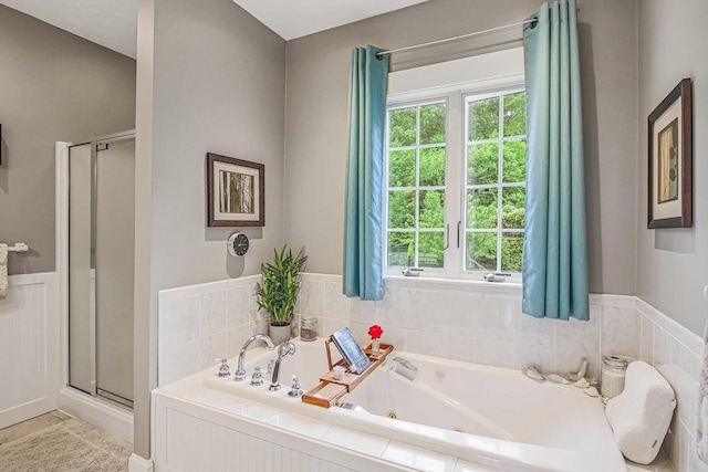 27 Southwick Rd, Sutton, MA 01590 - full bath with a stall shower, plenty of natural light, a jetted tub, and wainscoting