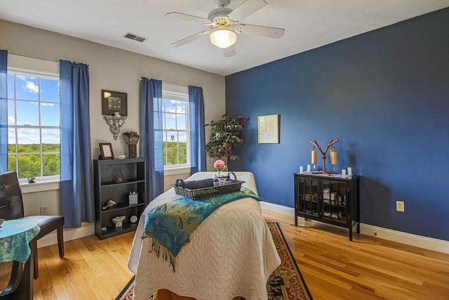 27 Southwick Rd, Sutton, MA 01590 - bedroom with light wood finished floors, multiple windows, baseboards, and ceiling fan