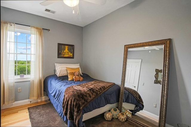 27 Southwick Rd, Sutton, MA 01590 - bedroom featuring light wood-type flooring, multiple windows, and baseboards