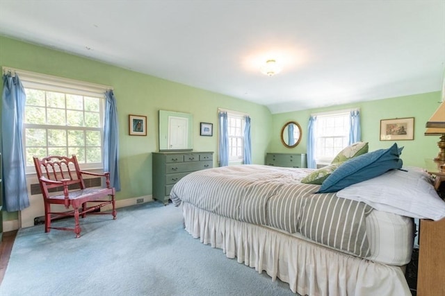 carpeted bedroom featuring baseboards