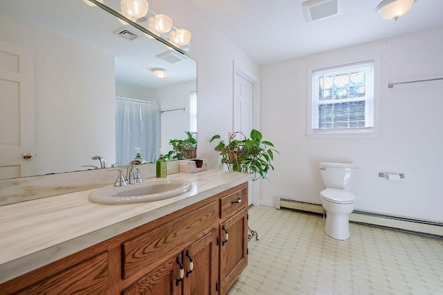 bathroom with visible vents, toilet, tile patterned floors, baseboard heating, and vanity