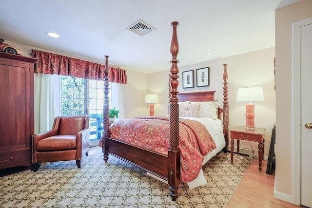 bedroom featuring recessed lighting, light wood-type flooring, visible vents, and baseboards