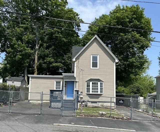 99 Allston St, Lawrence, MA 01841 - traditional home with a gate and a fenced front yard