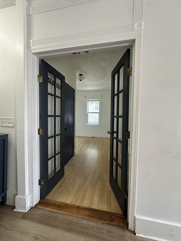 99 Allston St, Lawrence, MA 01841 - corridor with wood finished floors, french doors, and baseboards