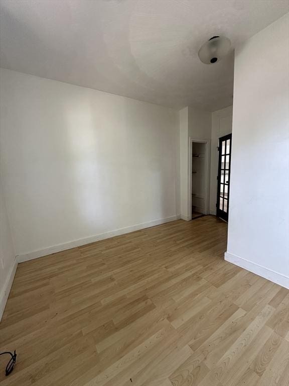 99 Allston St, Lawrence, MA 01841 - empty room with light wood-style floors and baseboards