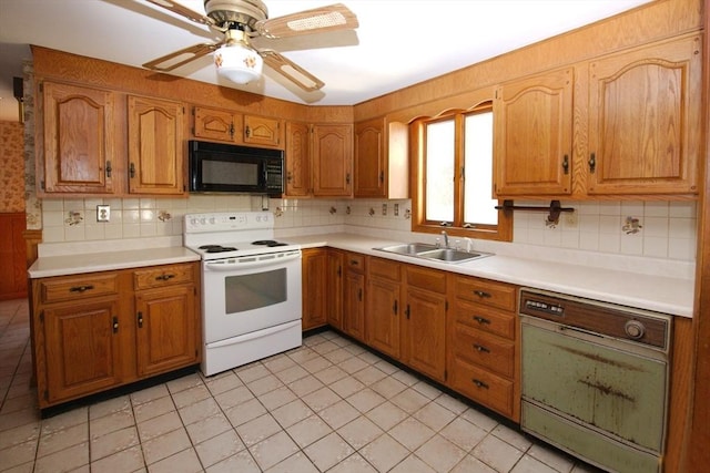 kitchen featuring black microwave, a ceiling fan, a sink, white electric stove, and decorative backsplash