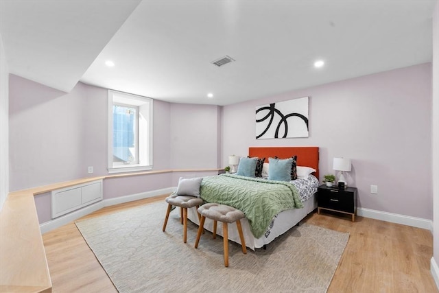 bedroom with light wood-type flooring