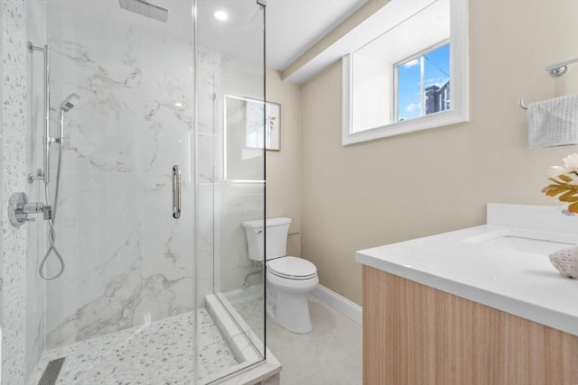 bathroom featuring walk in shower, vanity, and toilet