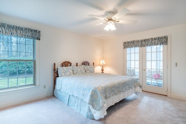 bedroom featuring ceiling fan, french doors, light carpet, and access to exterior