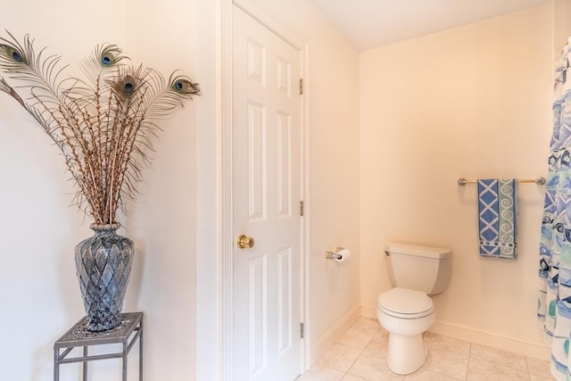 bathroom with tile patterned floors and toilet