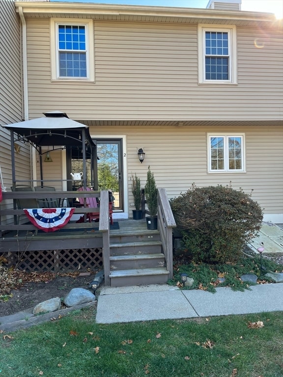 view of front of house featuring a gazebo and a wooden deck