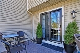 entrance to property featuring a wooden deck