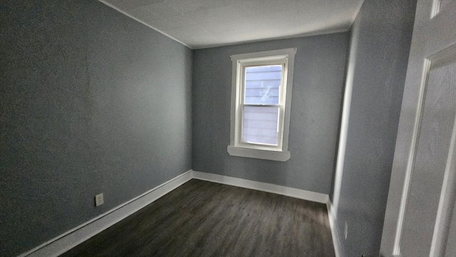 spare room featuring dark hardwood / wood-style flooring