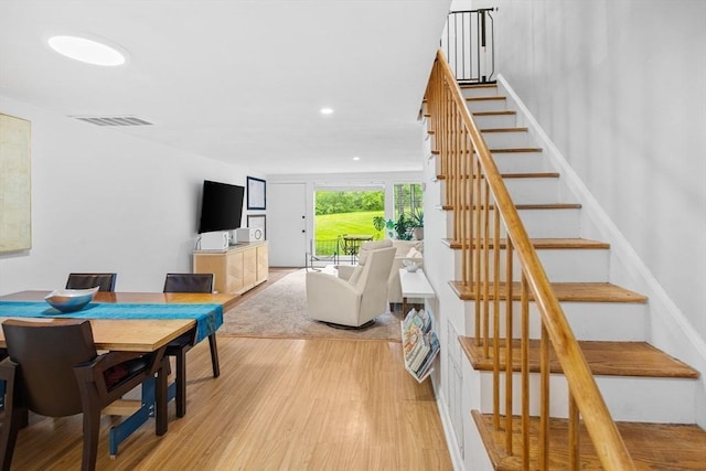 301 Neponset St Unit 12A, Norwood, MA 02062 - dining space featuring light wood-style floors, stairs, and recessed lighting