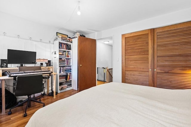 301 Neponset St Unit 12A, Norwood, MA 02062 - bedroom with a desk, a closet, and wood finished floors