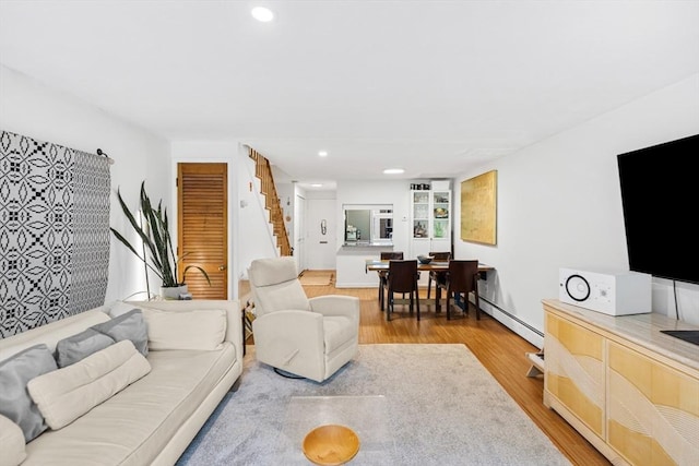 301 Neponset St Unit 12A, Norwood, MA 02062 - living area featuring light wood-style floors, stairs, recessed lighting, and a baseboard radiator