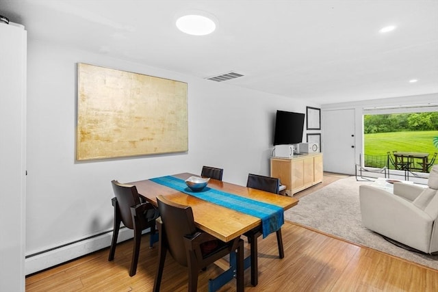 301 Neponset St Unit 12A, Norwood, MA 02062 - dining room with light wood-style floors, recessed lighting, and a baseboard radiator