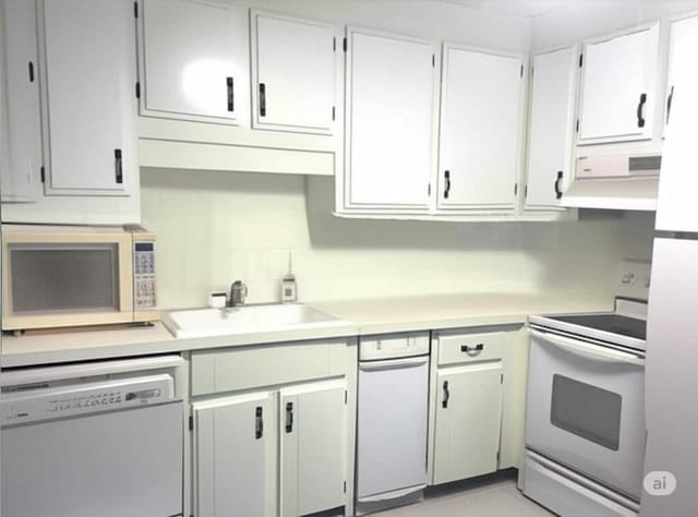 59 Katherine St, Weymouth, MA 02191 - kitchen featuring white appliances, under cabinet range hood, light countertops, a sink, and white cabinetry