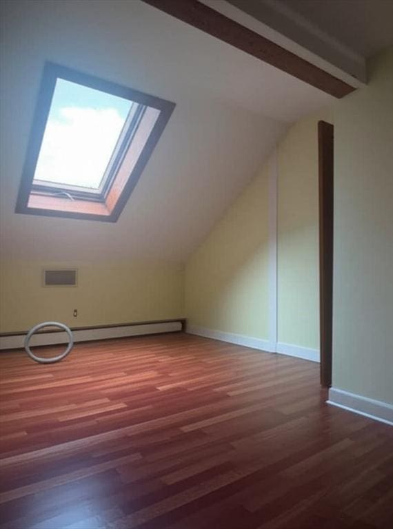 59 Katherine St, Weymouth, MA 02191 - bonus room featuring a skylight, wood finished floors, a baseboard radiator, and baseboards