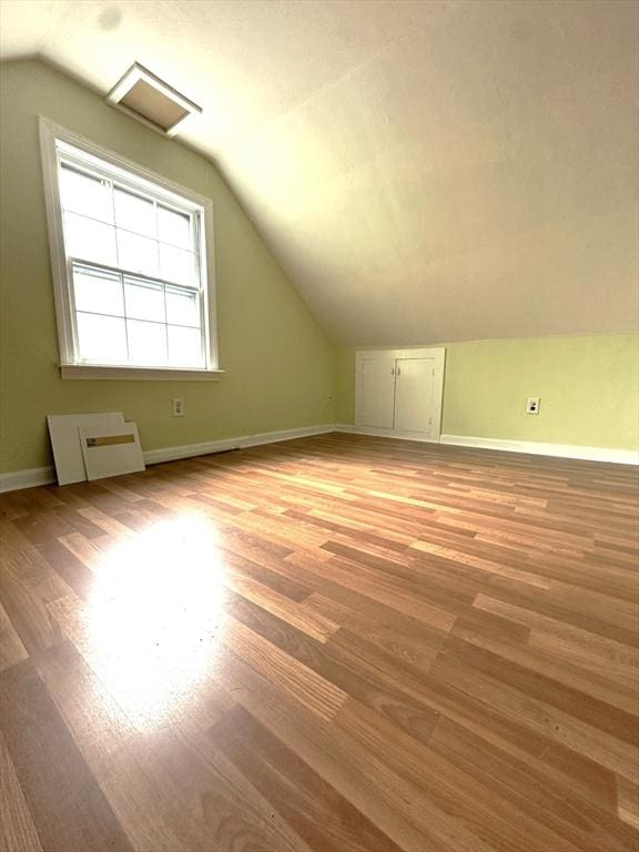 59 Katherine St, Weymouth, MA 02191 - additional living space with lofted ceiling, light wood-style flooring, and baseboards