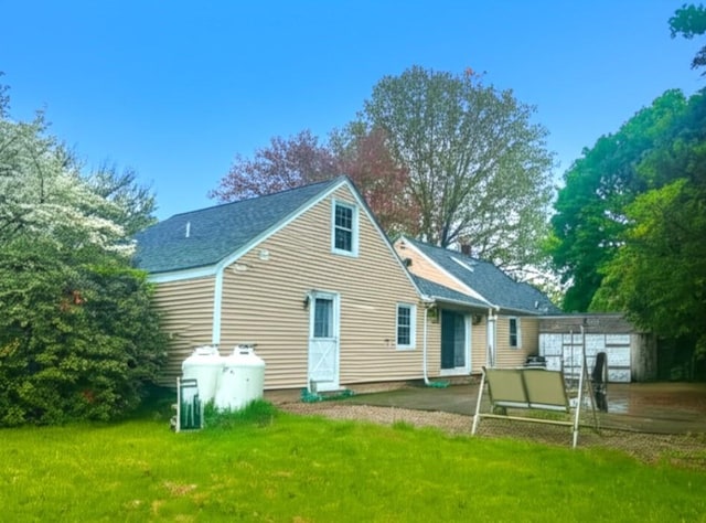 59 Katherine St, Weymouth, MA 02191 - back of house with a yard and a patio area