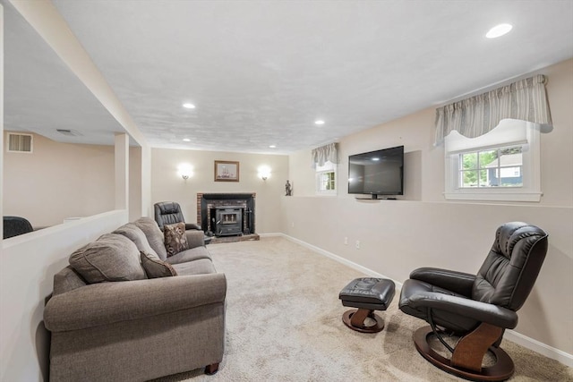 carpeted living room featuring baseboards and recessed lighting