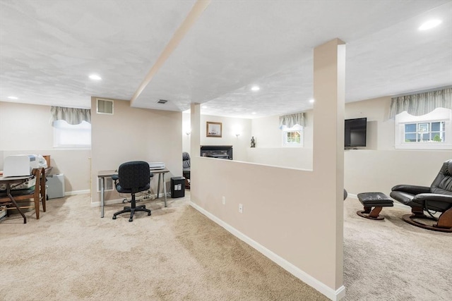 carpeted office space with recessed lighting and baseboards