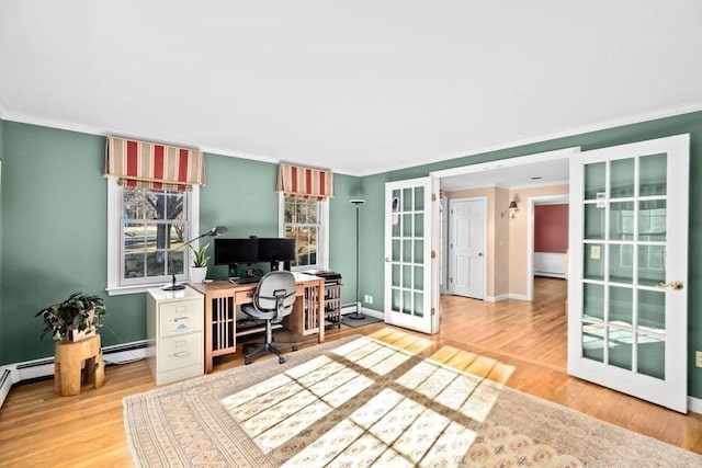 office space featuring crown molding, hardwood / wood-style floors, baseboard heating, and french doors