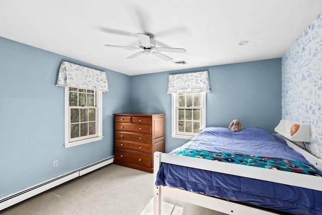 bedroom featuring carpet floors, a baseboard radiator, and ceiling fan