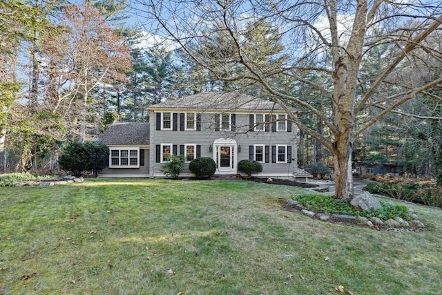 colonial-style house with a front lawn