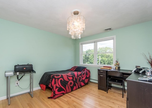 140 College Farm Rd, Waltham, MA 02451 - bedroom with baseboard heating, light wood-style flooring, a chandelier, baseboards, and a desk