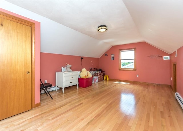 140 College Farm Rd, Waltham, MA 02451 - additional living space with light wood-style floors, lofted ceiling, a baseboard radiator, and baseboard heating