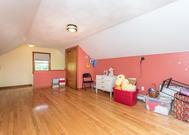 140 College Farm Rd, Waltham, MA 02451 - additional living space with hardwood / wood-style flooring, a baseboard radiator, vaulted ceiling, and baseboards
