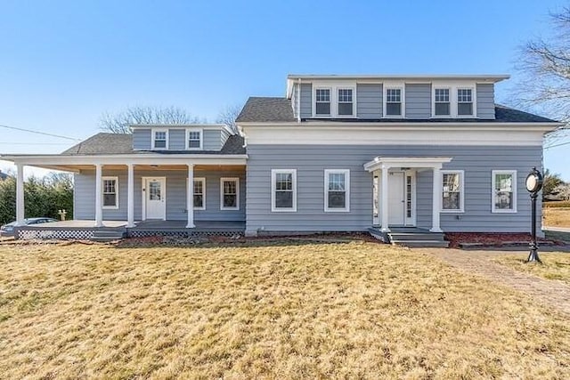 view of front of property featuring a front lawn and covered porch