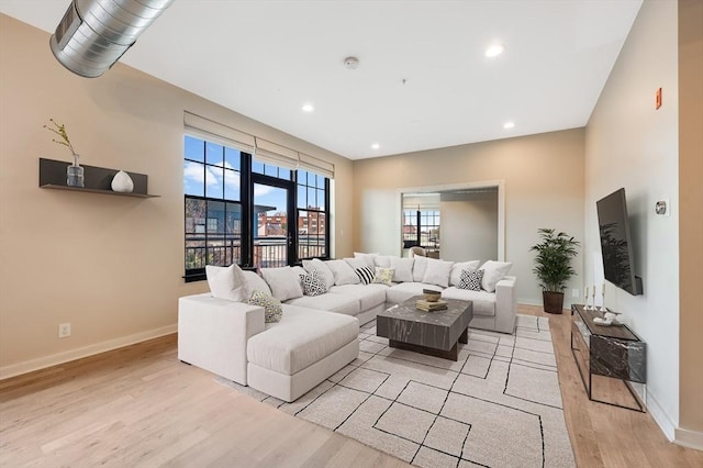 living room with light hardwood / wood-style flooring