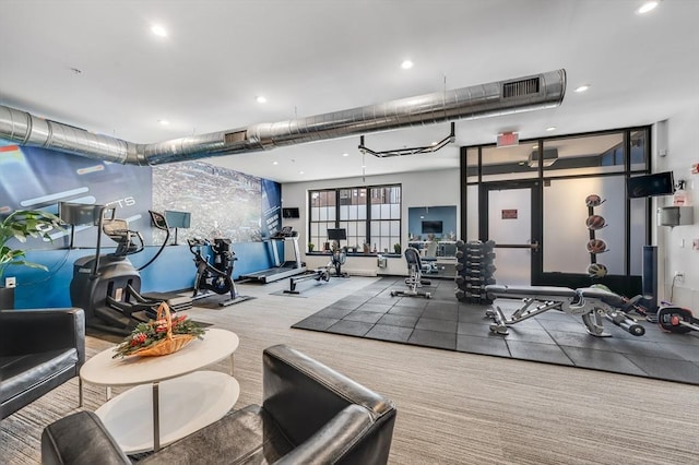 gym featuring light colored carpet