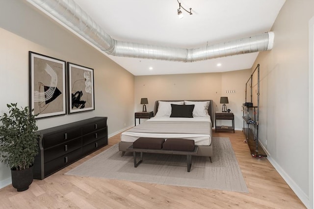 bedroom with light hardwood / wood-style flooring