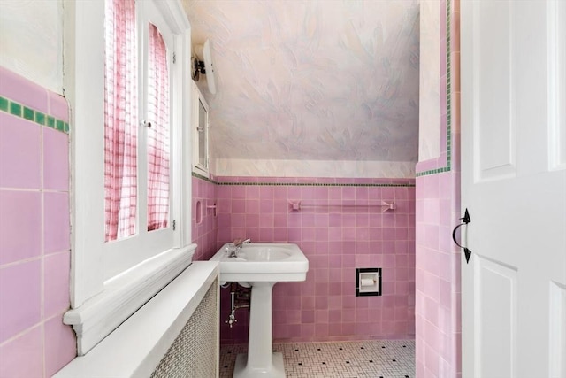 bathroom with tile walls