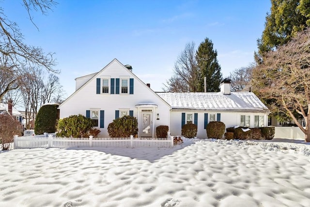 view of front of property featuring fence and a chimney