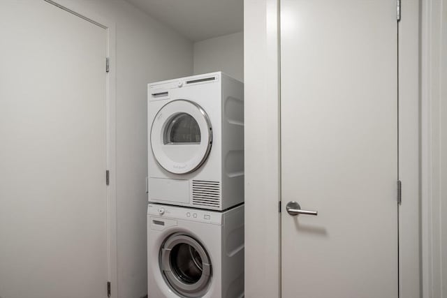 laundry room featuring stacked washing maching and dryer