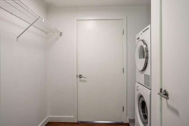 laundry area featuring stacked washer and clothes dryer