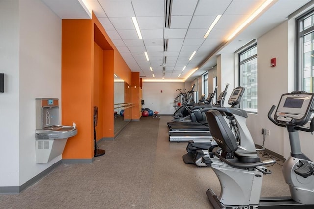 gym featuring a drop ceiling