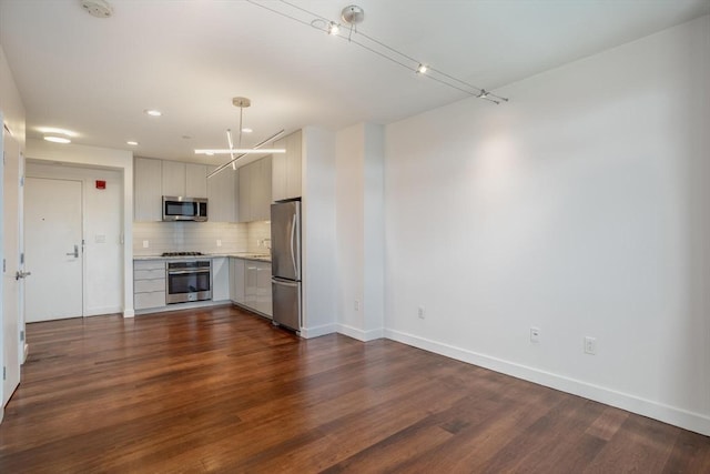 unfurnished living room with dark hardwood / wood-style floors