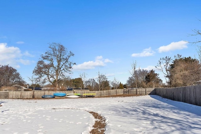 view of yard layered in snow