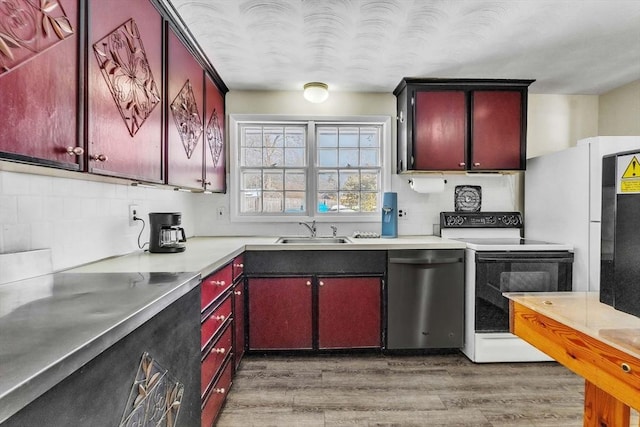 kitchen with dark hardwood / wood-style floors, tasteful backsplash, dishwasher, sink, and electric range